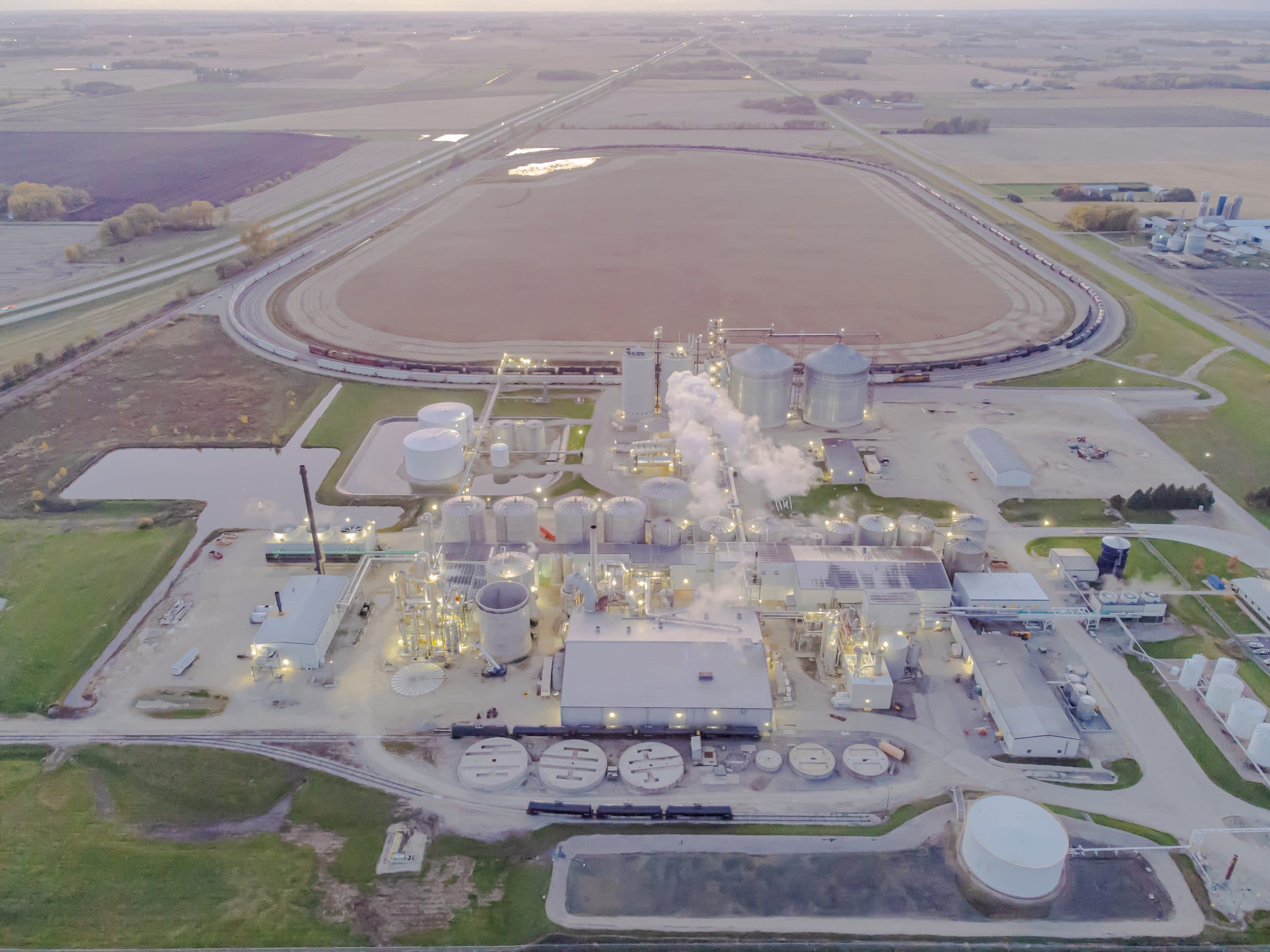 Aerial view of a renewable fuels production plant at dusk